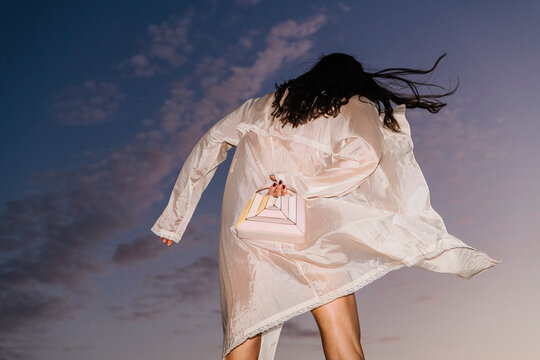Evening Fashion Shot With Flowing Coat