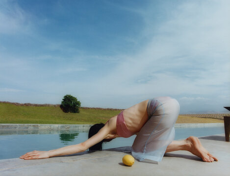 Yoga Stretch by Pool in Pastel Light