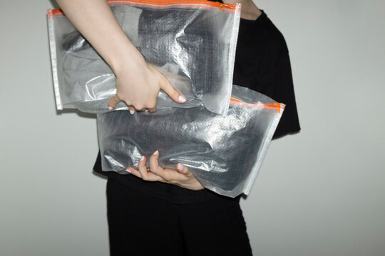 Transparent travel plastic packs full of items with flashlight