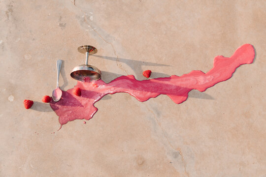 Raspberry Smoothie Spill With Fallen Glass and Spoon