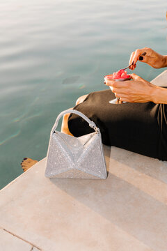 Glamorous Silver Purse at Poolside With Sorbet