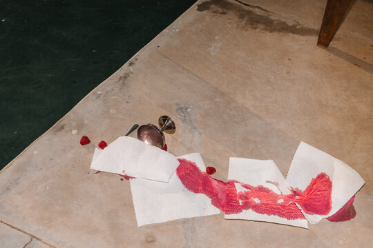 Spilled Wine Glass and Raspberries by Pool