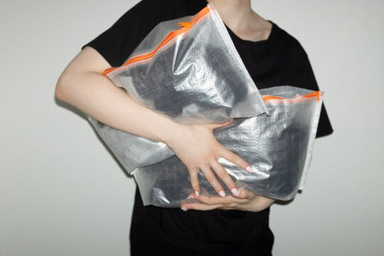 Transparent travel plastic packs full of items with flashlight