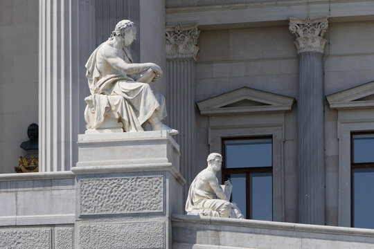 Classical statues on the Austrian Parliament Building in Vienna, Austria. 