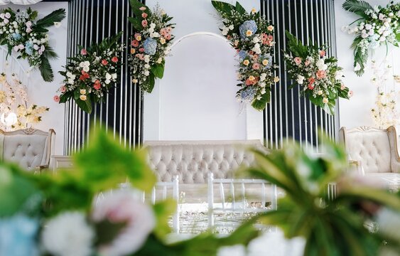 Elegant wedding stage decoration with lush floral arrangements and soft ambient lighting for a romantic celebration atmosphere