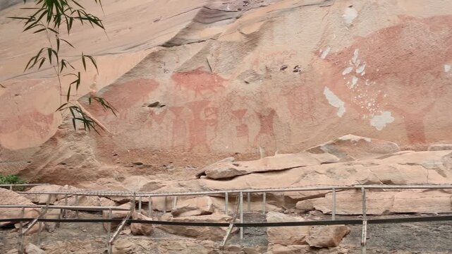Ancient prehistoric cliff rock painting at Pha Taem National Park, Ubon Ratchathani, Thailand.