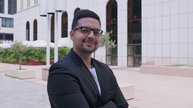 Confident technology startup founder smiling outdoors