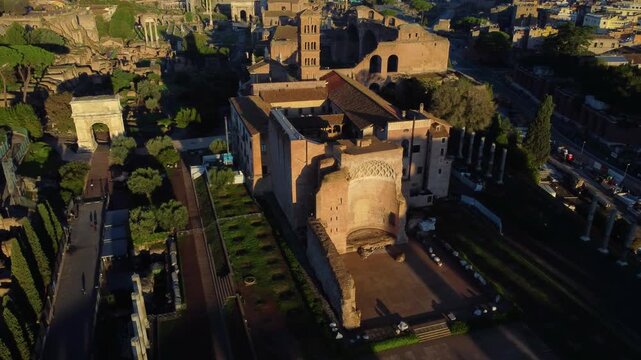 Aerial view of the Roman Forum ruins with ancient stone structures and pathways in Rome, Lazio, Italy.