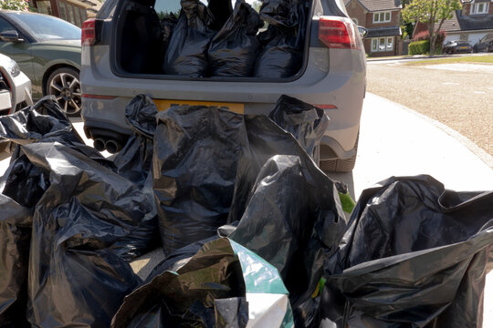 Car loaded with household waste ready for a trip to the recycling centre. Declutting, home clearance and responsible waste disposal