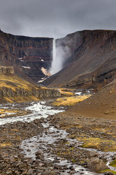 Hengifoss waterfall canyon with red paleosol strata layers Iceland