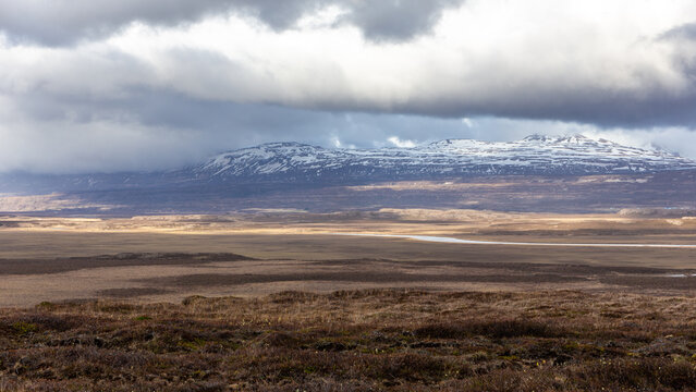 Snowcapped mountain range over tundra valley near Borgarfjordur Eystri Iceland