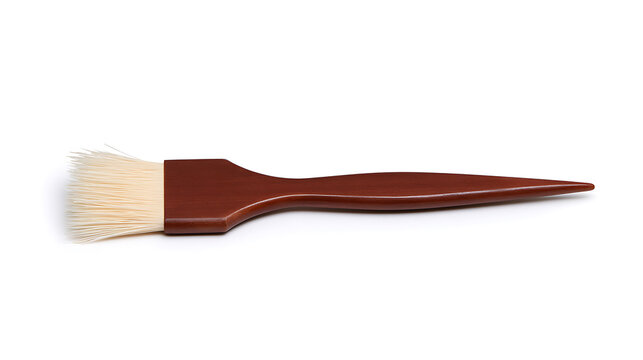 A single wooden hair dye brush isolated on a clean white background, perfect for beauty salons and professional cosmetic applications today