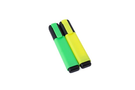 Green and yellow fluorescent highlighter marker pens isolated on a white background