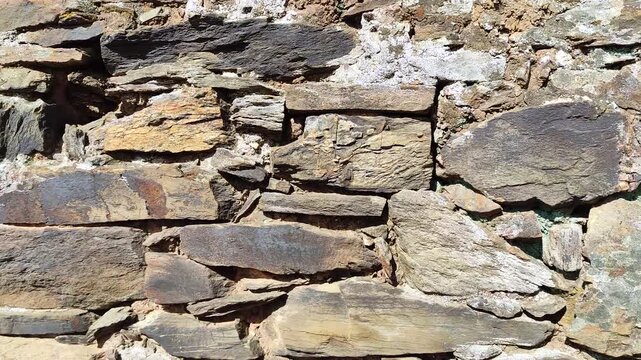 Slate stones stacked to form a solid wall
