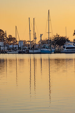 Boats Docked in Gulf Shores Alabama Harbor During Sunset With Reflections on the Water