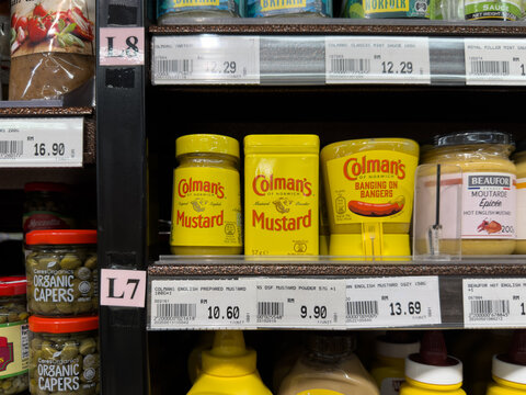 PENANG, MALAYSIA - MAY 25, 2026: Colman's mustard products displayed on supermarket retail shelf.