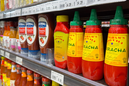 PENANG, MALAYSIA - JUL 03, 2026: Lingham's chili sauce and Hellmann's tomato ketchup displayed on supermarket retail shelf.