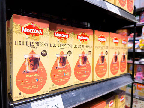 PENANG, MALAYSIA - JUL 03, 2026: Moccona Liquid Espresso coffee boxes displayed on supermarket retail shelf.