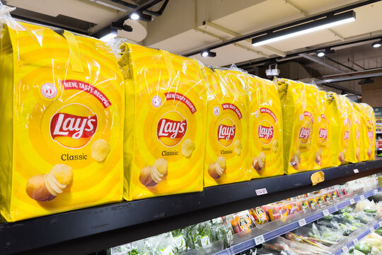 PENANG, MALAYSIA - JUL 03, 2026: Lay's Classic potato chips multipack display on supermarket grocery shelf.