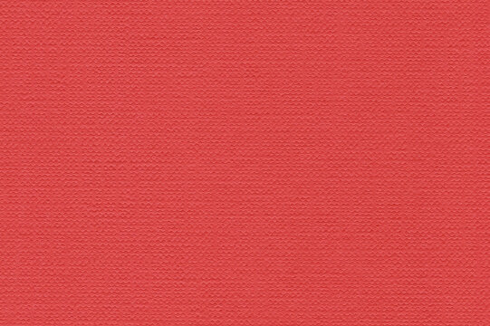 Coral red embossed cardstock texture presents an even red field beside dense raised pattern across the background, providing a firm cardstock surface for craft backgrounds alongside pastel studies