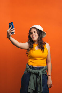 Young generation z teen girl making selfie grimace