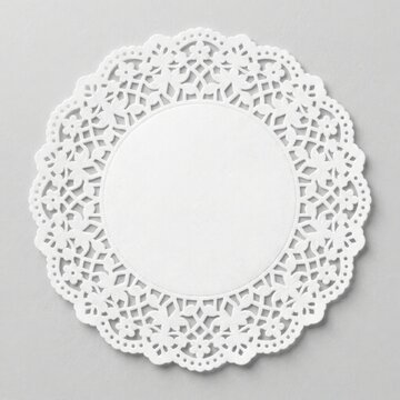 White paper doily with intricate lace pattern isolated on white background