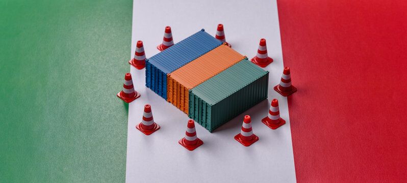 The cargo container ban on the Italian flag as a conceptual backdrop. Cargo container embargo