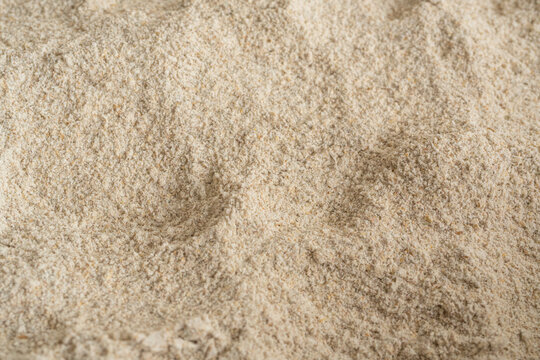 Wheat flour powder textured background, spelt grain dust pattern