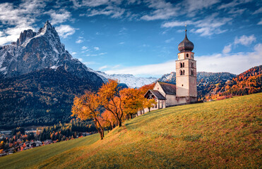 Astonishing morning view of snowy Petz peak and St. Valentin ( Kastelruth ) church in autumn...
