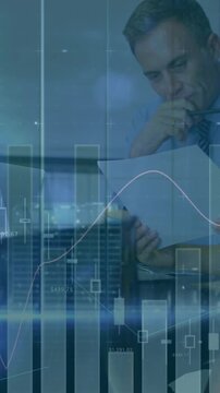 Analyzing financial data, business professionals with stock market animation in background