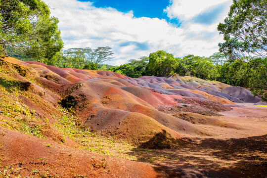 Chamarel Seven Colored Earth Geopark in Mauritius Island. Colorful panoramic landscape about this volcanic geological formation Chamarel Seven Colored Earth Geopark in Riviere noire district.