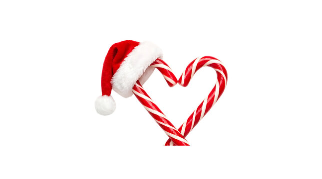 Two candy canes shaped as a heart with a small santa claus hat