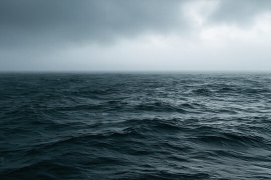 Dark ocean waves under a cloudy sky