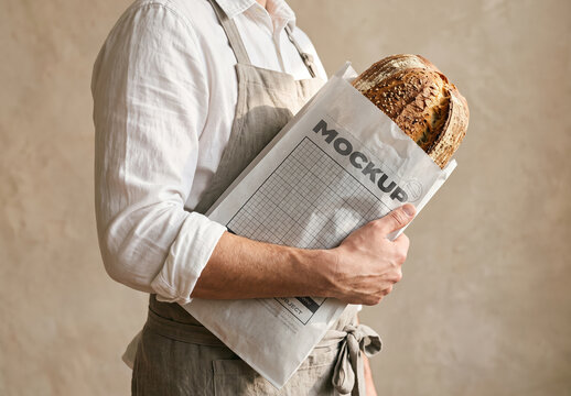 Bakery Worker Holding Paper Bag Design Branding Mockup