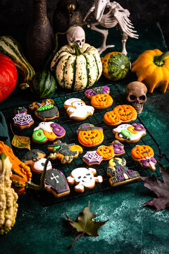 Halloween cookies in shape of bat ghost jack-o-lantern and skull