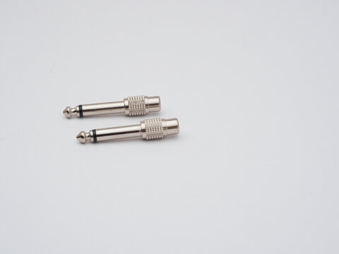 Two Silver Audio Jack Adapters - Two shiny silver 6.35mm (1/4 inch) TS audio jack adapters are isolated on a clean white background, ready for use.