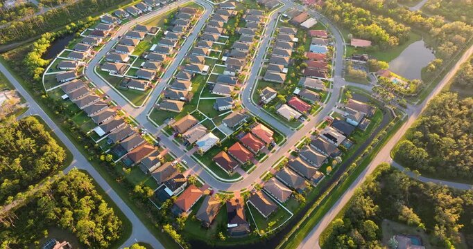 American gated community houses in rural US suburbs. View from above of large residential homes in small town in southwest Florida