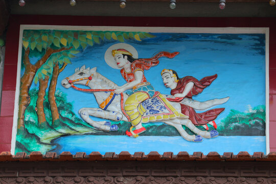 Great Renunciation of Prince Siddhartha Gautama on wall bas relief panel, future Buddha leaving palace at night riding on white horse Kanthaka with his loyal servant Channa