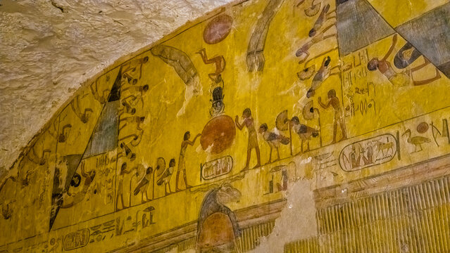 Ancient Egyptian hieroglyphics and mythological wall paintings depicting journey to afterlife inside Tomb of Ramesses VI in Valley of Kings, Luxor, Egypt
