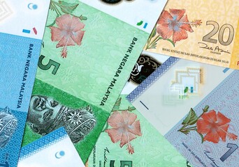 Malaysian ringgit money bills in pile on table. Malaysia MYR currency cash close up © Viktor
