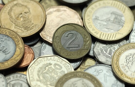 Big pile of coins from various different money currencies. Treasure and numismatics concept