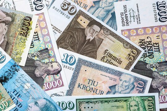 Icelandic krona money bills in pile on table. Iceland ISK currency cash close up
