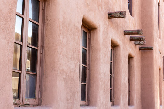 Adobe Wall with Repeating Windows and Vigas