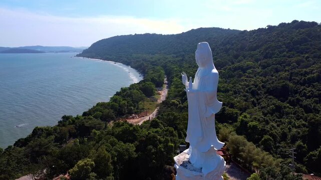 White Guanyin Statue Overlooking the Ocean at Ho Quoc Pagoda in Phu Quoc, Vietnam: 4K Drone View
