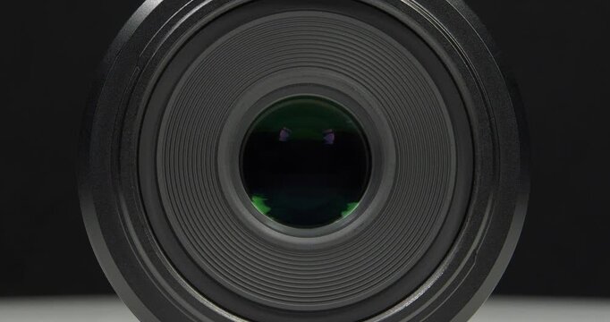 Black macro camera lens, zoom-out video