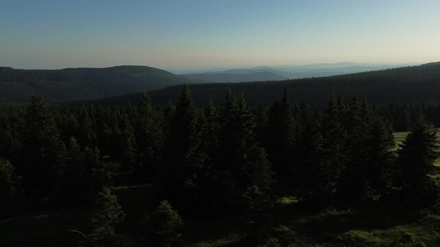 Aerial view of Voseck&aacute; bouda mountain shelter bathed in golden hour light, Karkonosze Mountains