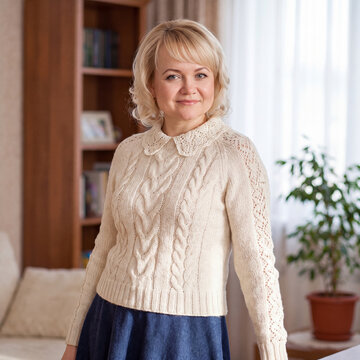 Portrait of a beautiful young woman in woolen knitted clothes