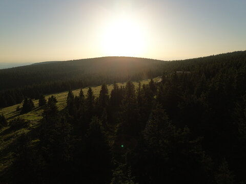 Aerial view of Voseck&aacute; bouda mountain shelter bathed in golden hour light, Karkonosze Mountains
