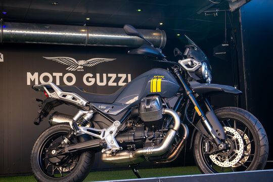 MANDELLO DEL LARIO, ITALY - NOVEMBER 4, 2026: A Moto Guzzi V85 Strada 105th Anniversary special edition motorcycle on display at an official booth during the annual Moto Guzzi rally. The celebratory a