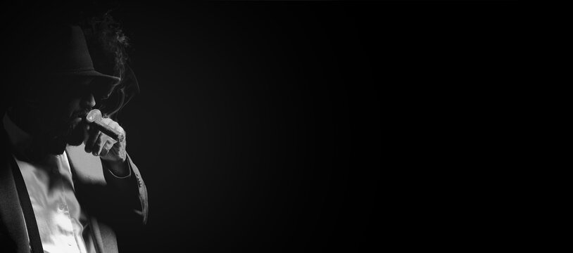 Mafia. Man in hat smoking cigar on dark background. Banner design with space for text